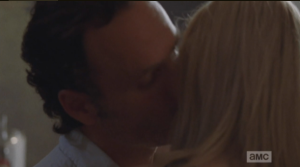 As he takes the baby from her, Rick sneaks a kiss on Jessie's cheek. 