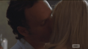 As he takes the baby from her, Rick sneaks a kiss on Jessie's cheek.