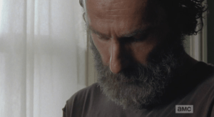 Rick looks down at his watch.