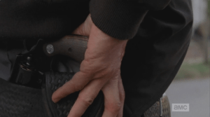 ...and we see Rick Smash!'s hand reach for the gun he took from Carol. (I think this is more a symbolic gesture, not literal, in this moment...another moment, soon, perhaps.)