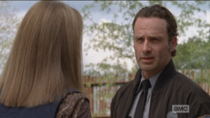 Rick brings Deanna outside, points out that the walls need to be partrolled always, not just checking for damage, but also for any activity or signs that they had been breached. Rick also points out that someone could move right up the supports on the outside of the walls. 