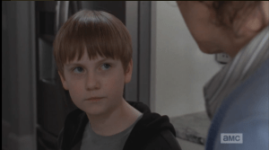 Sam looks at Carol.