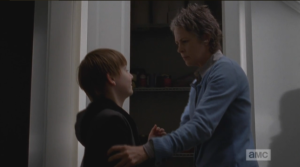 Carol pulls Sam out of the cupboard, asks him angrily what he's doing there...Sam cheerfully informs her that he didn't tell anybody about the guns. That kid sure doesn't scare easy!