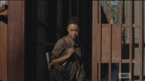 Sasha thanks the gate keeper as she walks out of Alexandria into the world outside the gates.