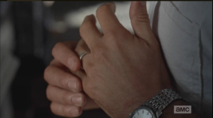Then he reaches down and twists his wedding ring...is it time to take it off?