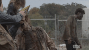 ...while Aaron uses his newfound Alaska license plate to slice through the walkers' brains, like a walker-killing MacGyver.