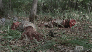 It is a truly distressing and horrifying sight. We see an arm, the hand bearing a wedding band...these were once living people, presumably huddled around a small campfire just the night before...living people, out in the open, just trying to make it the best they could.