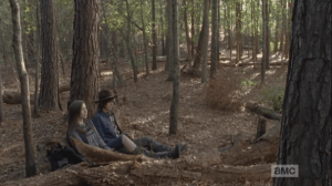 Still laughing at her walker prank, Enid and Carl find a felled tree stump and sit down to take a breather.