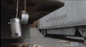 As they approach the tractor trailers, Daryl and Aaron don't seem to notice that each trailer has a couple of empty cans, with holes punched through and strung up alongside, or under, the trailers. They catch the wind, and seem to be some kind of noisemakers...
