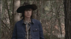 Carl peers around, looking for Enid, when he hears her voice call out,