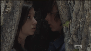Carl and Enid turn to face one another...