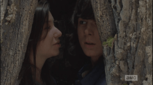 After a moment, it becomes too much for Carl, and he turns away, exhaling a long-held breath. Enid smiles at this.