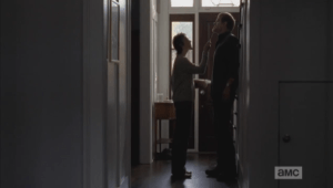 Carol holds the knife under McBeaty's chin, not letting up.