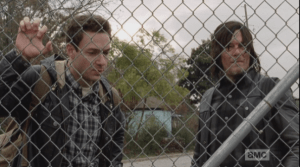 As Daryl surveys the trucks through the fence, Aaron laments,