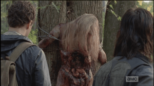 The arms, and legs, and now this...it speaks of a sadistic cruelty and methodology being executed, as the woman was clearly stripped, lashed to a tree, helpless, and left for walkers to tear into.
