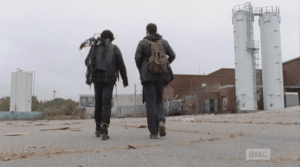 After making quick work of rekilling the walkers through the fencing, Daryl and Aaron pull open the gate, and make their way towards the trailers.