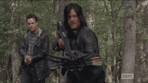 As Aaron takes this all in, Daryl lifts his crossbow and stealths forward, as he realizes, 
