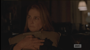 A light knock on the front door surprises Deanna out of her reverie, and she looks up, goes to the door to see who it is.