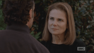 This isn't Deanna Monroe's first game of seven-card-stud, and it's showdown time. She narrows her eyes at Rick.