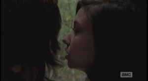 Carl tears his gaze away from Enid and looks out with alarm towards the walkers, whose snarl and slaver grow louder as they get closer. Enid leans in towards Carl and whispers to him,