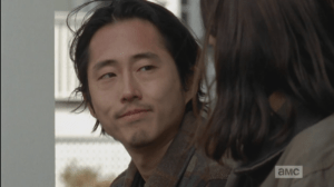 Instead of voicing his real thoughts, Glenn smiles at Maggie, tells her,