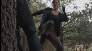 She pins I Think It's Broken Walker to a tree, winds back, ready to stompkick...