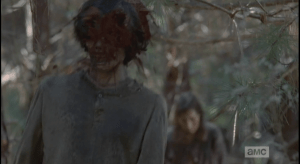 Michonne looks around, sees Sasha scrambling to reload, and has her sister's back by standing firm and continuing to blow away oncoming walkers...