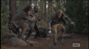 After Morgan leaps away from the young assailant's first strike, he grabs his staff and whirls around, delivering a swift blow to the dark haired young man, knocking him to the ground.