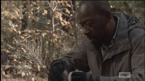 Morgan takes the cup from the fire, rips open a packet of instant soup or something, and pours the contents in the cup. As he stirs his breakfast, the shot pans out...