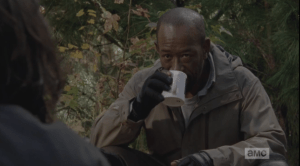 Morgan's hand pauses, the mug stops mid-sip. He lowers the mug.