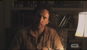 Nicholas turns his eyes to the camera, trying for an earnest expression. 