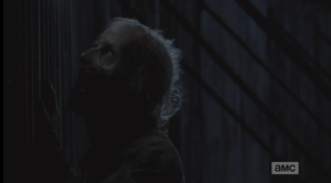 Meanwhile, You Got A Little Something On Your Face There, Walker has reached the Alexandrian walls and paws at the gates, snarling and trying to get in.