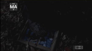 As the walker lurches, snarling, through the woods, we see it step upon a shattered framed picture lying in the grass...