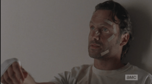 Rick looks away, turns up his hand like a shrug, then looks back at Carol. (You said it yourself, Rick Grimes...here you are.) Locking eyes with Carol, Rick says,