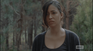 Sasha looks up and sees Rosita looking at her, sadly. Sasha has been through so much, has lost so much in a short period of time...first Bob, then Tyreese...and Noah's death is affecting them all deeply. Rosita and Michonne know that Sasha's struggling right now.