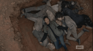 ...and the shot pans out as Sasha closes her eyes, opens her arms, and surrenders to the strange peace of lying on top of the fallen walkers.