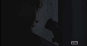 Sasha is unable to hold the gun steady, keeps trying to bring herself back under control.