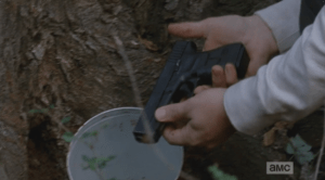It seems that Rick Grimes isn't the only one stashing guns around these woods! (This couldn't be Rick's gun, could it?)