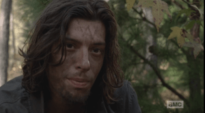 The young man looks at Morgan. His eyes are devoid of any feeling or compassion.
