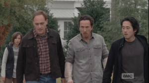 Tobin, Nicholas, and Glenn take a step towards Rick, and then back away quickly...