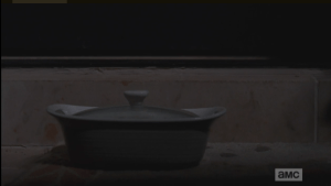 Deanna goes back into her home and closes the door, leaving the casserole untouched on the doorstep.