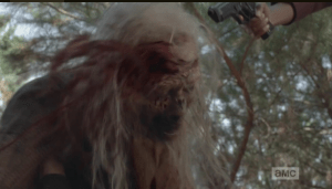 Sasha is having a hard time getting her knife, which lay just out of reach above her head, so Michonne steps up and rekills White Walker, executioner style. Buh bye, While Walker.