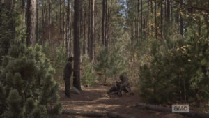 ...and we see another figure approach, a young man with dark hair, who steps forwards, across from where Morgan sits, balancing playfully on a rock a moment before stepping down. Morgan says nothing, does not acknowledge the young man's presence.