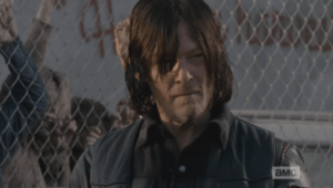Daryl looks down at the map, then up at Morgan a couple of times, trying to wrap his head around what is happening. Morgan returns his gaze in an open, friendly manner, his eyebrows raised in silent question.
