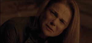 Deanna looks up at Rick, anguished.