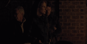 Deanna Monroe's face looks grim as she waits with Reg, Spencer.