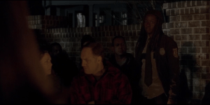 Michonne looks around at the assembled Alexandrians, then at Deanna Monroe.