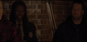 Michonne speaks up, says archly,