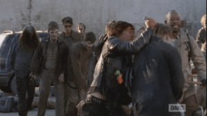...as Daryl stabs at the walkers, and Morgan takes them out with his staff. Between the three of them, they are able to clear a line to the gate and quickly get outside, pulling the gate closed behind them, barring the walkers' way.