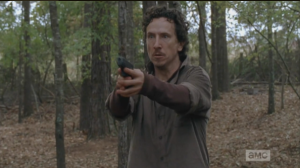 Nicholas is running through the woods, buggin' hard, trying to find Glenn, who he shot, and lost...he sees a figure moving through the trees, raises his gun.